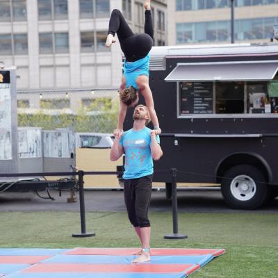 Jeremy basing Maria in Hand to Hand at AcroDayCamp 2022